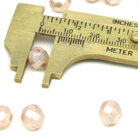 8.5mm Faceted Ovals, Pale Peach Pearlized Glass