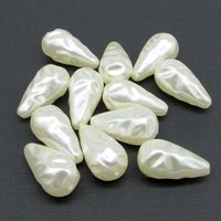 Vintage cream plastic pearl teardrops come in your choice of 22x11.5mm, 27x13.5mm, or 30x15.75mm sizes. The center-drilled lengthwise holes are approximately 1mm. These large droplets have a wrinkly baroque texture.
