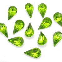 Vintage tin table cut pear shape rhinestones are translucent bright olive green backed with gold foil. Point back stones measure 13mm long and 7.8mm wide.