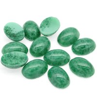 14x10mm vintage glass cabochons are opaque green faux jade matrix, meant to mimic natural stone. Smooth flat back gems have a 5mm dome and unfoiled backs.