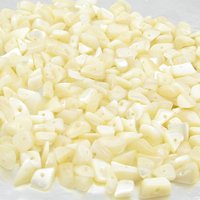 Lustrous, undyed mother of pearl chips are small freeform nuggets measuring approximately 5mm to 8mm long and 3mm to 5mm thick. Bead holes measure 0.8mm to 1.0mm in diameter.