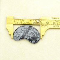 Length of the of the snowflake obsidian cabochon, as measured with a caliper.