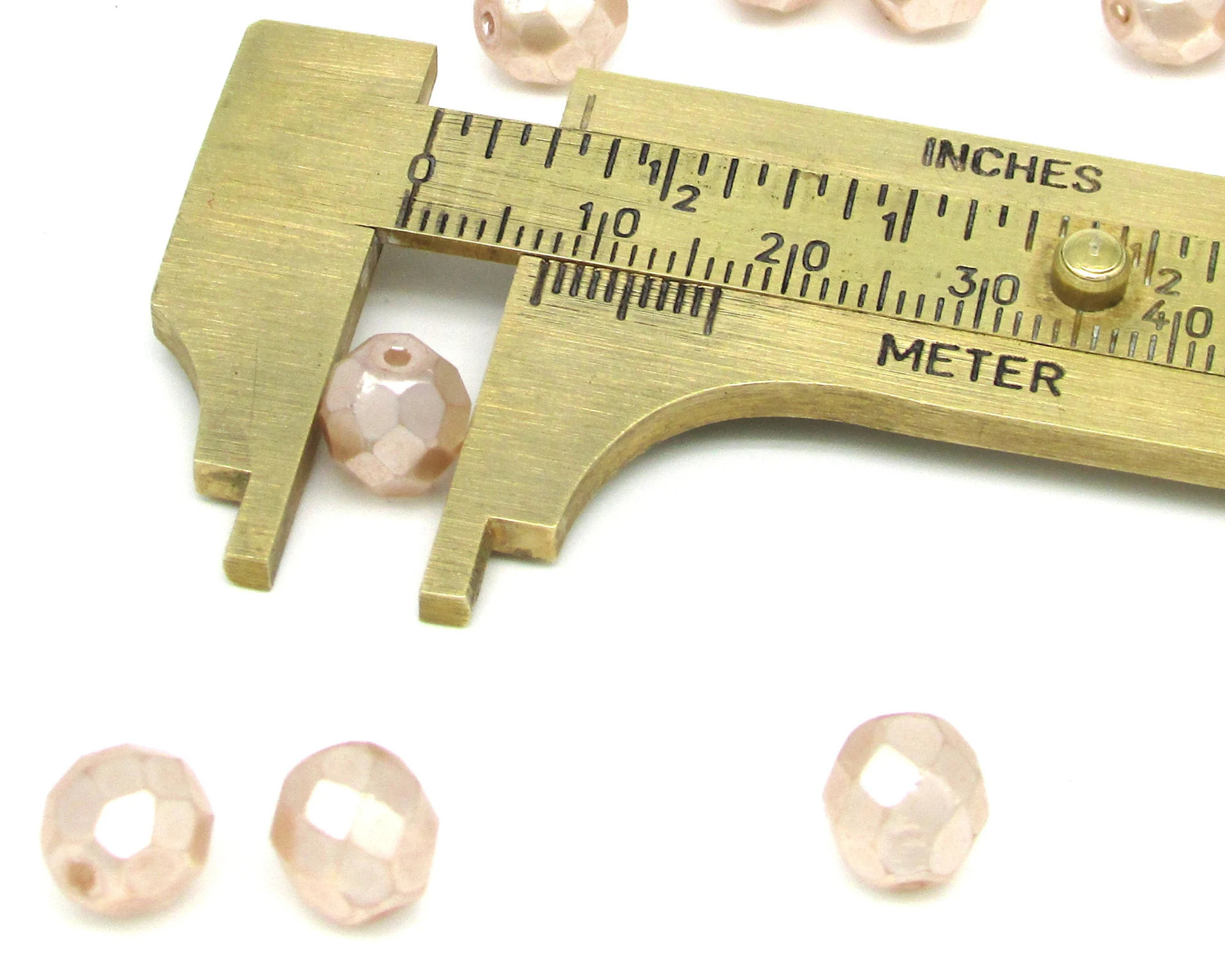 8.5mm Faceted Ovals, Pale Peach Pearlized Glass