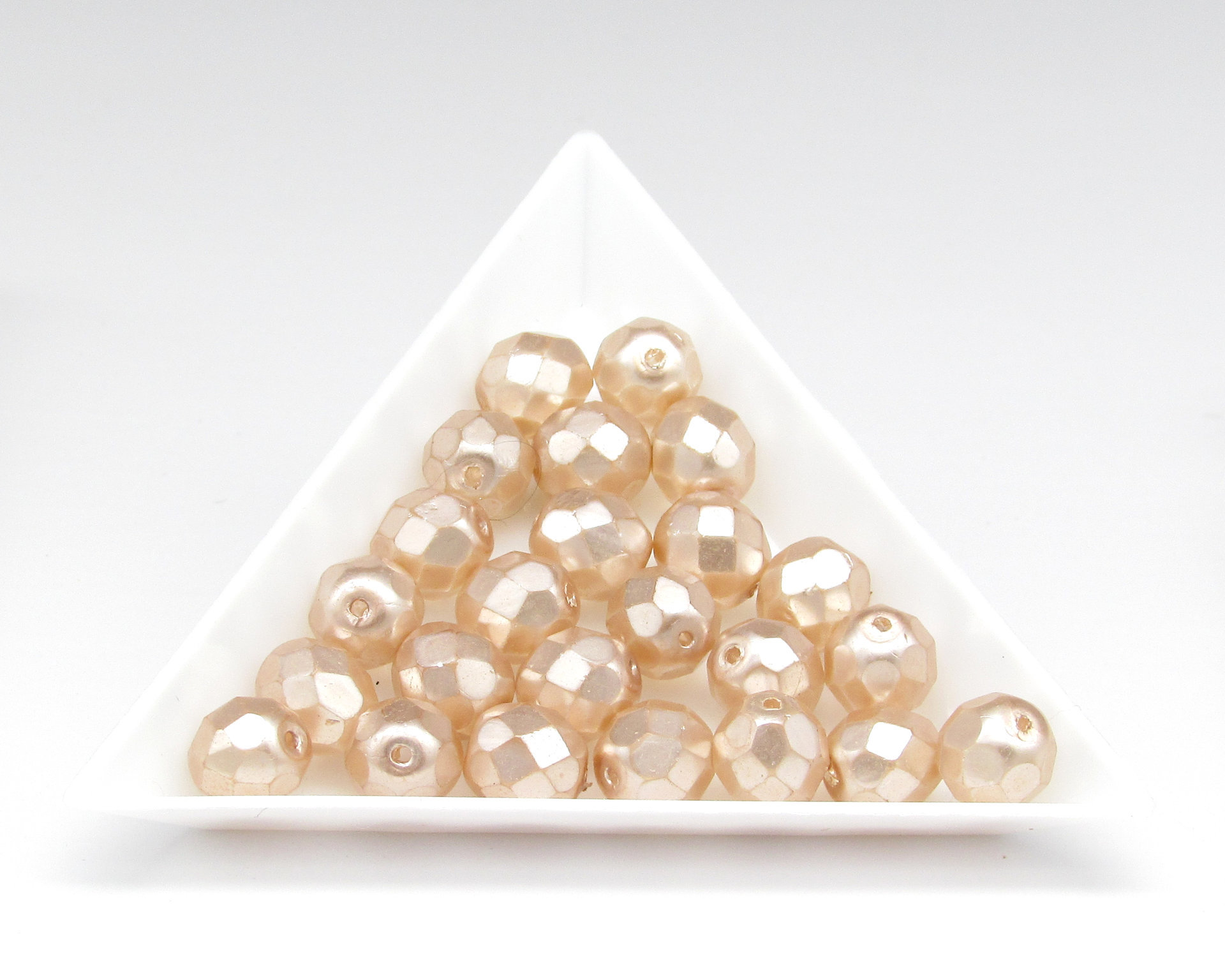 8.5mm Faceted Ovals, Pale Peach Pearlized Glass