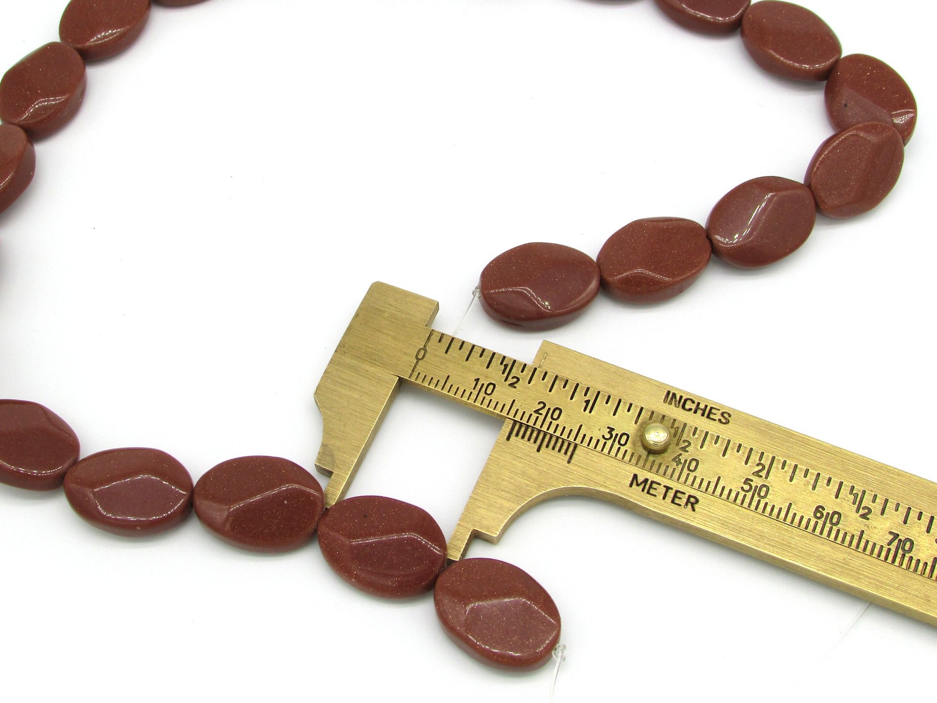 18mm Flat Oval Beads, Faceted Goldstone