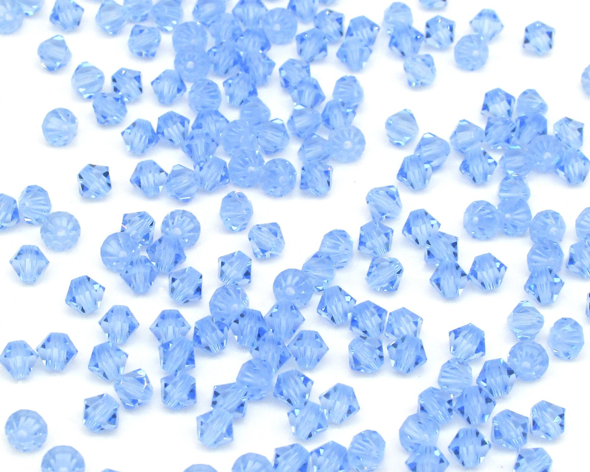 Vintage 4mm Bicone Beads, Light Sapphire Machine Cut Crystal Spacers