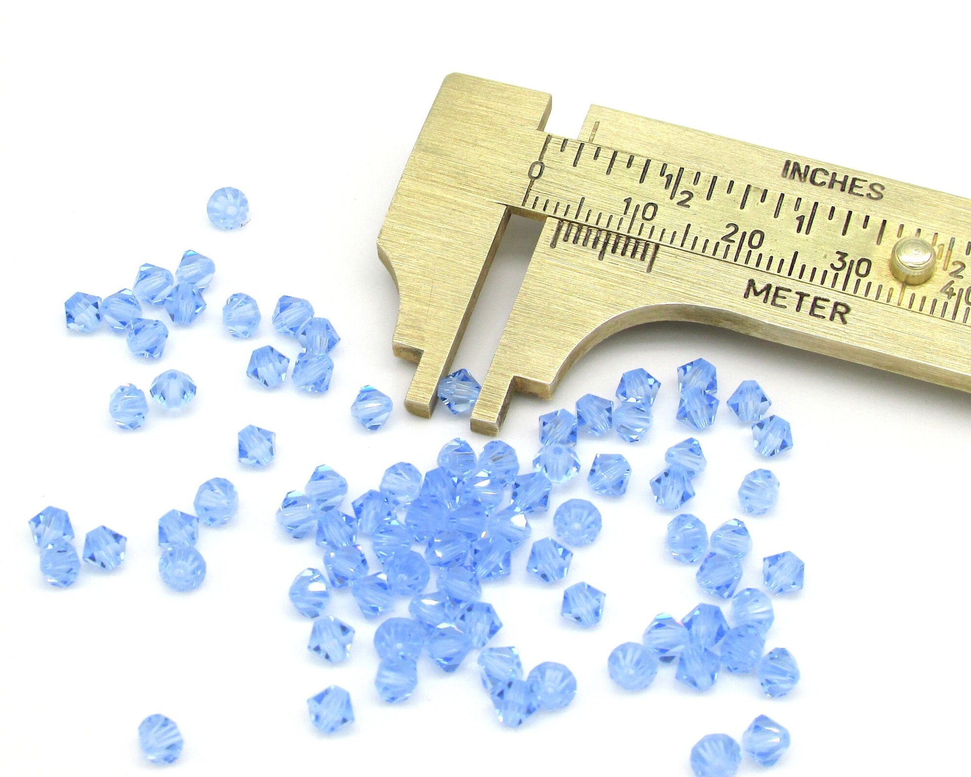 Vintage 4mm Bicone Beads, Light Sapphire Machine Cut Crystal Spacers