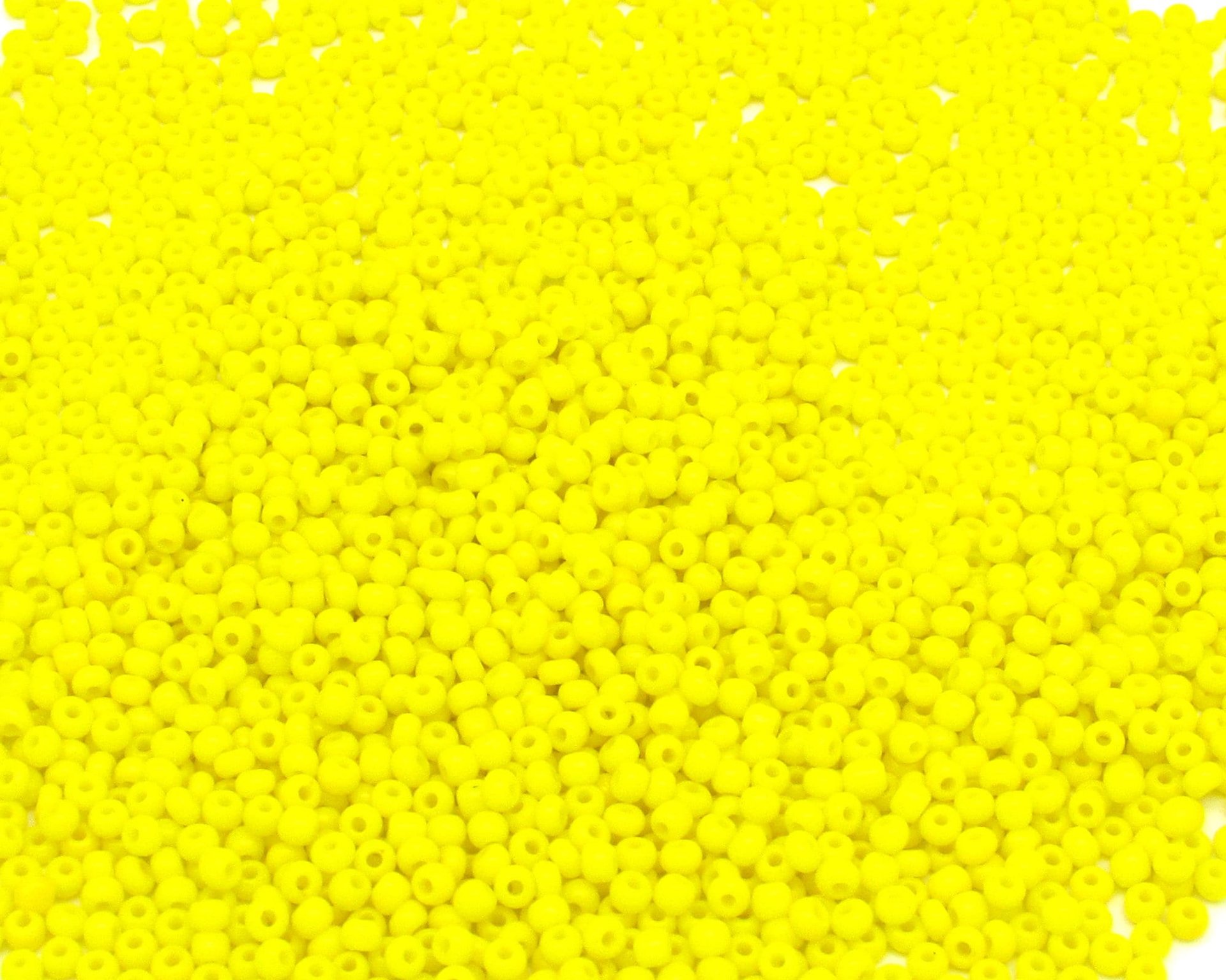 11/0 seed beads are opaque yellow glass. Tiny opaque rocailles average 2x1.5mm with round 0.64mm holes