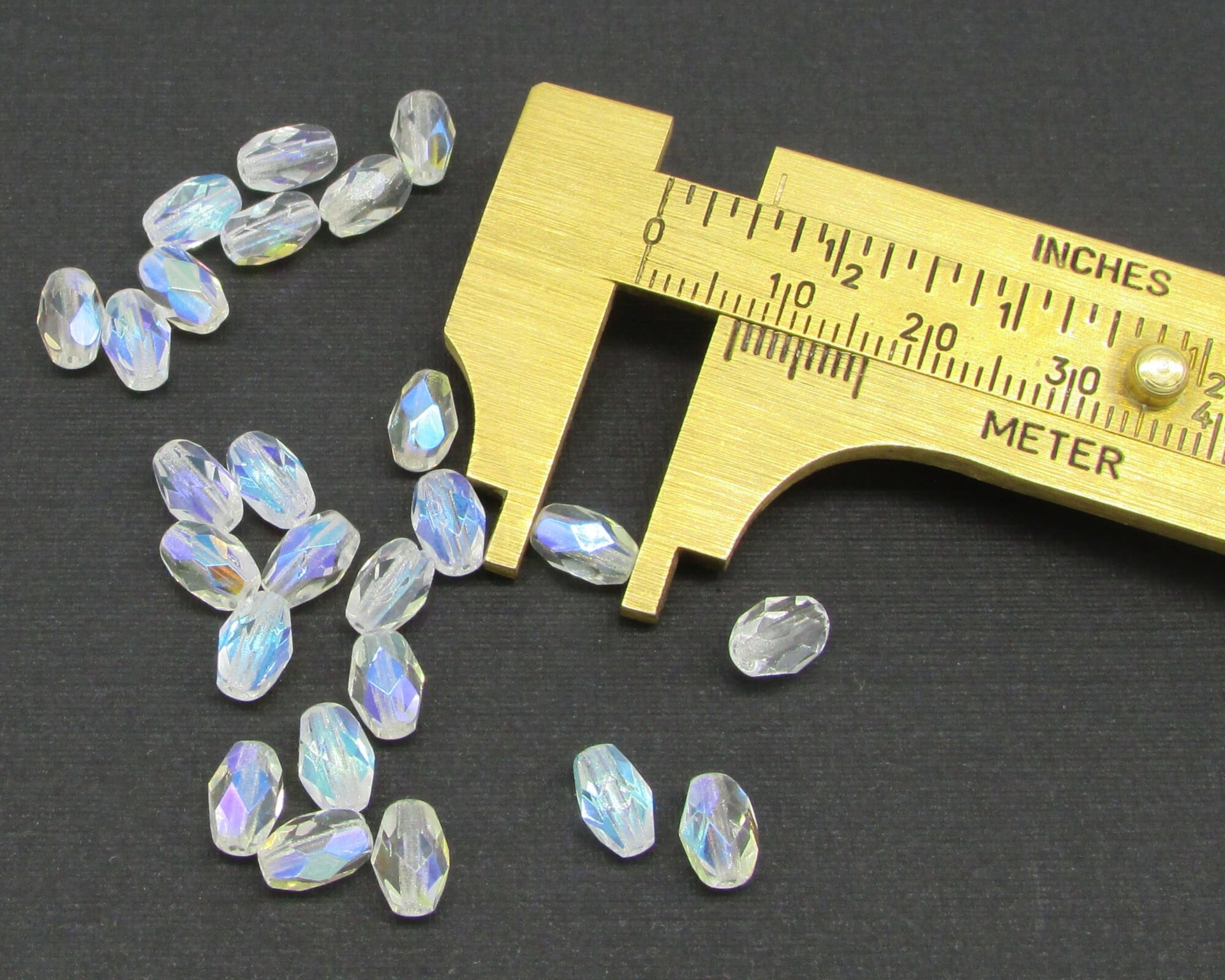 7x5mm Faceted Oval Barrels, Crystal AB Fire Polished Czech Glass Beads