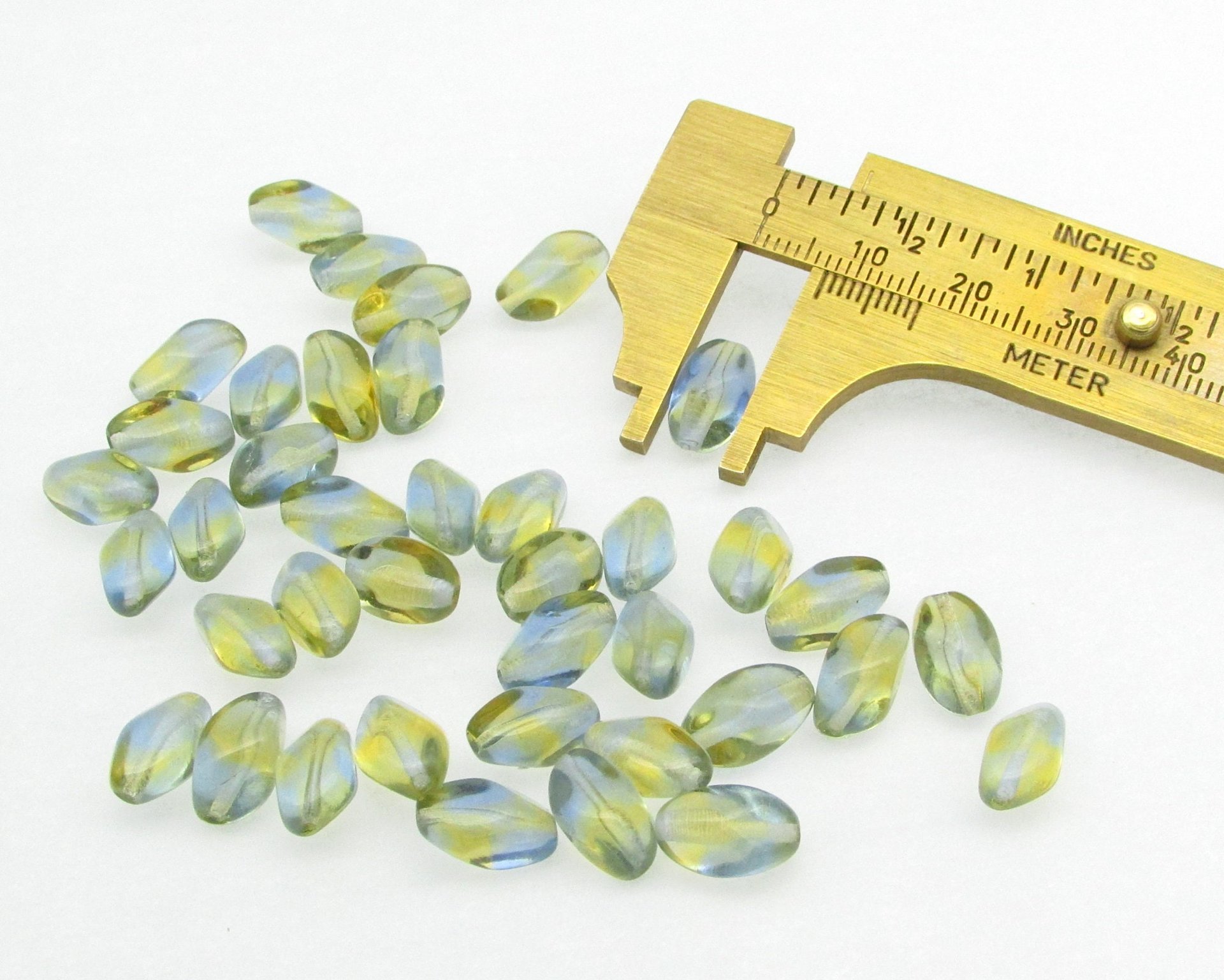 11x7mm Pinched Oval Beads, Baroque Barrels, Translucent Czech Pressed Glass