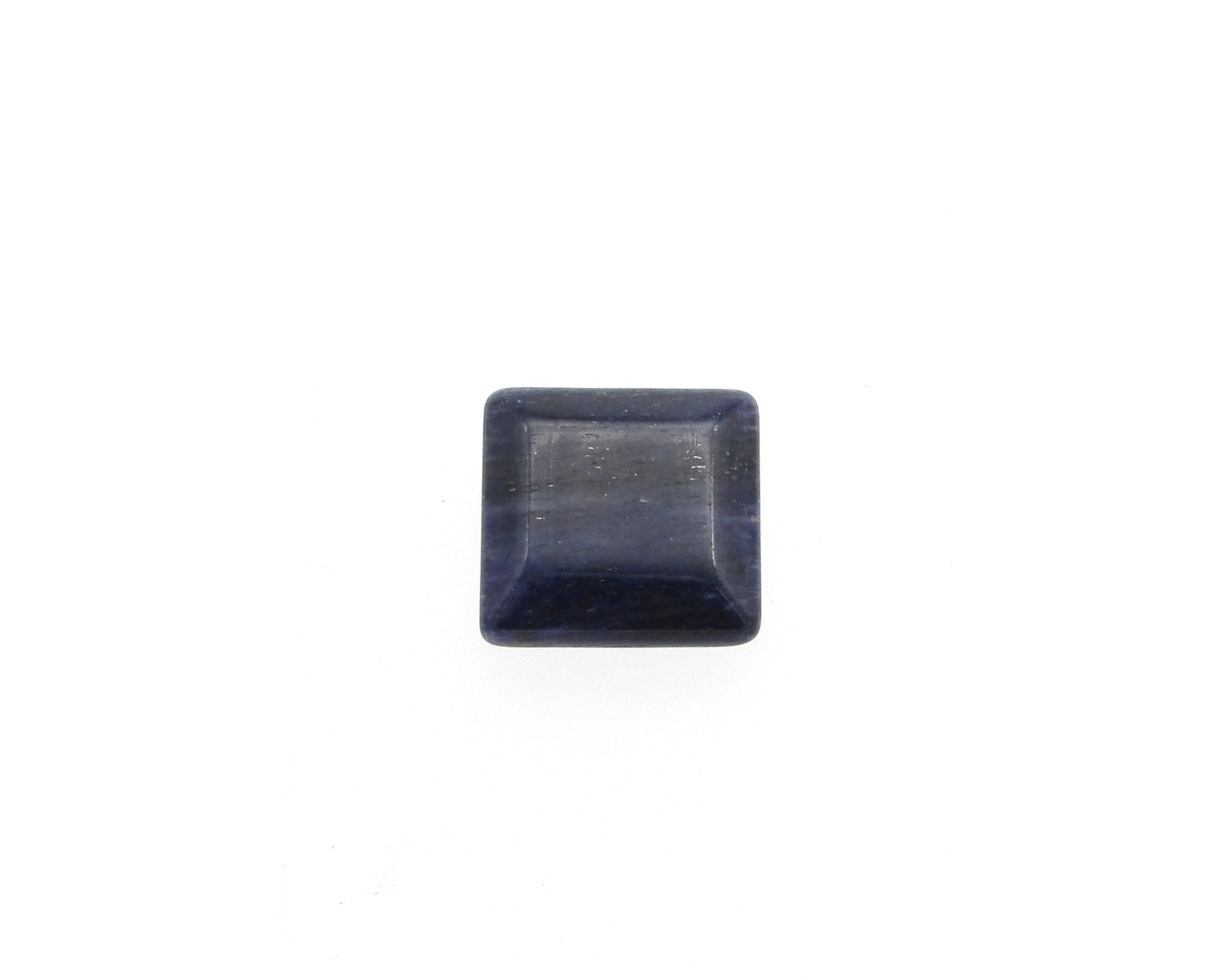 Dark blue sodalite gemstone cabochon is a smoothly polished beveled square measuring approximately 17mm across and 4.5mm thick.