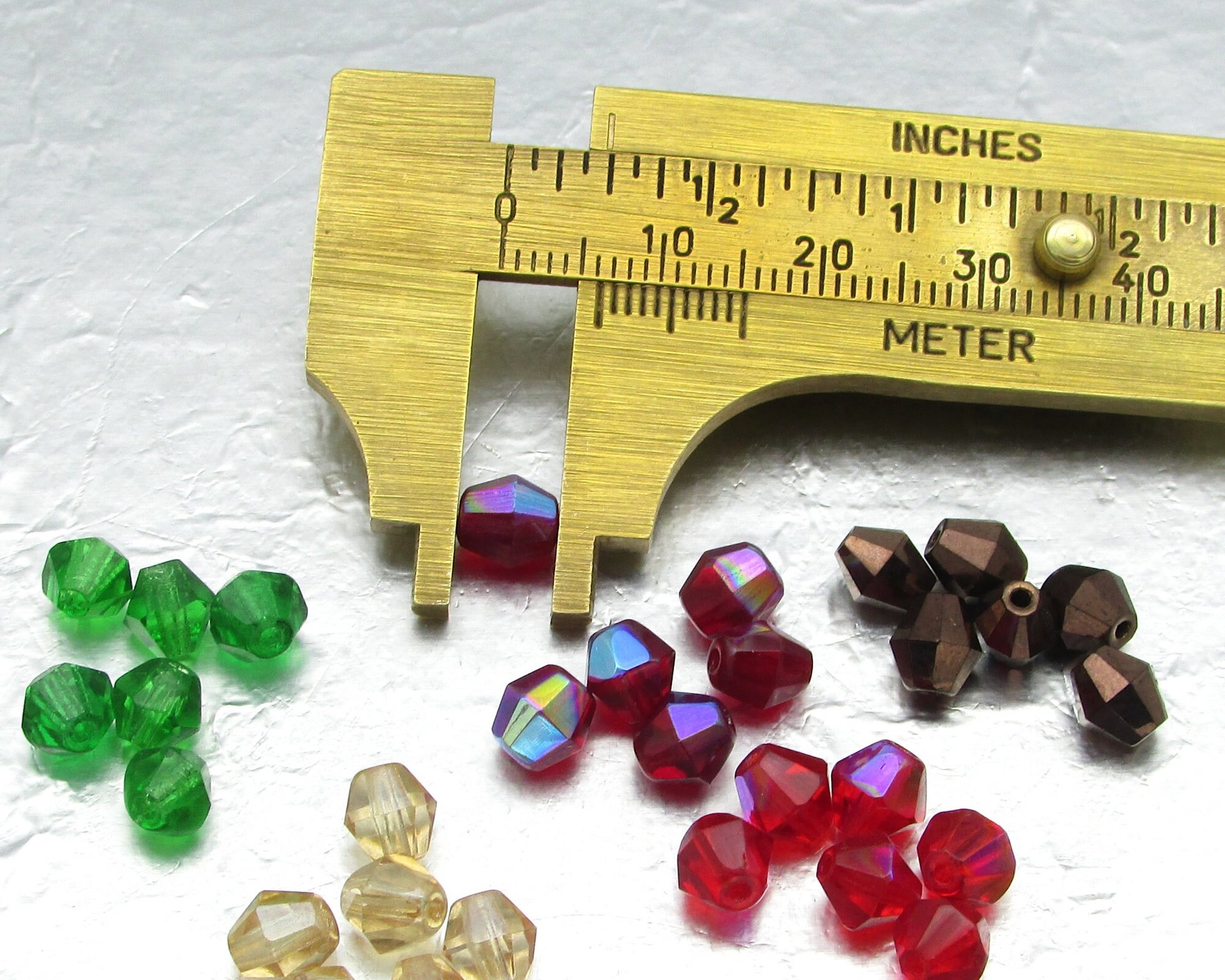 Vintage 6mm Siam AB Faceted Bicones