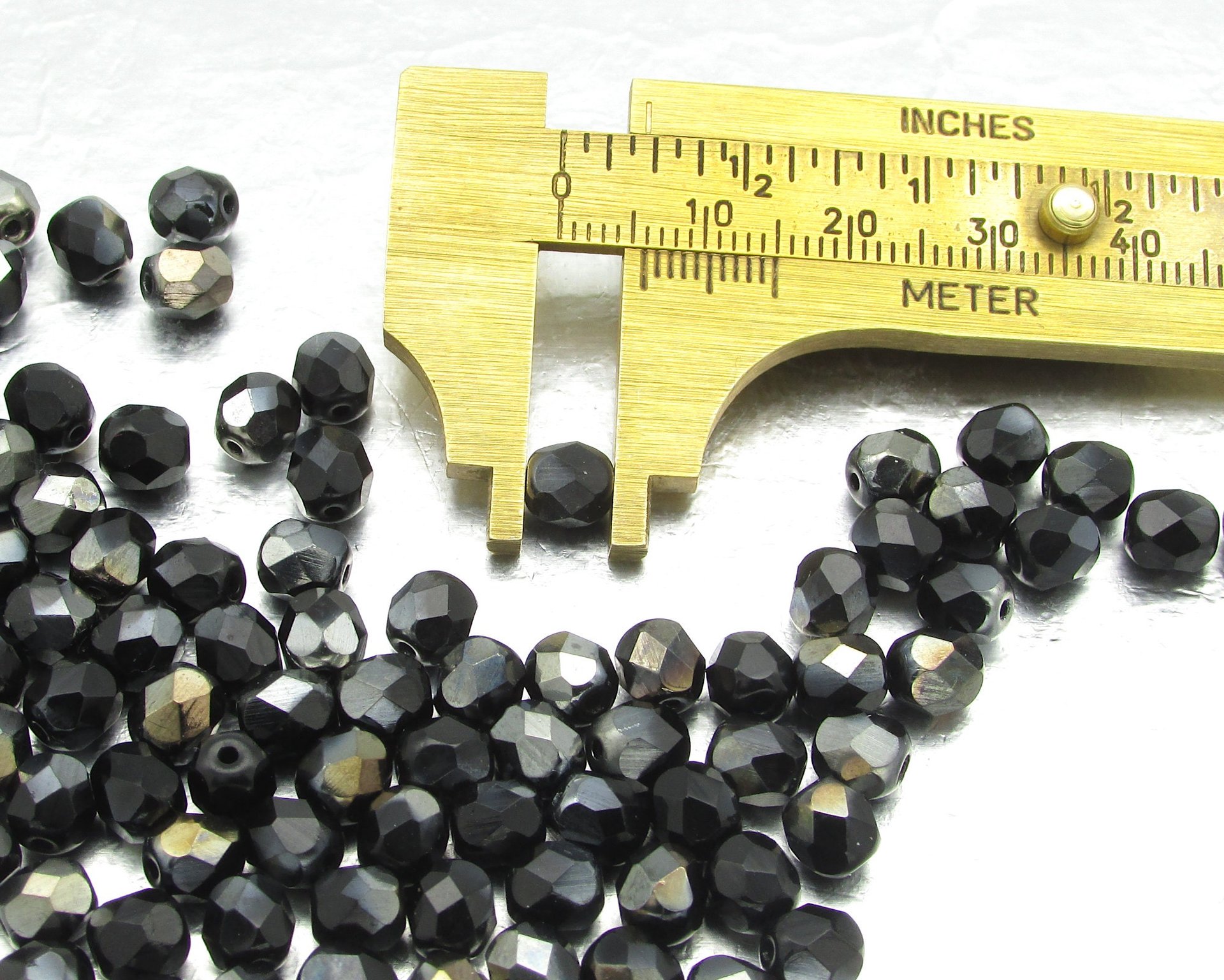 6mm Faceted Rounds, Jet Valentinite Half-Coat Glass Beads