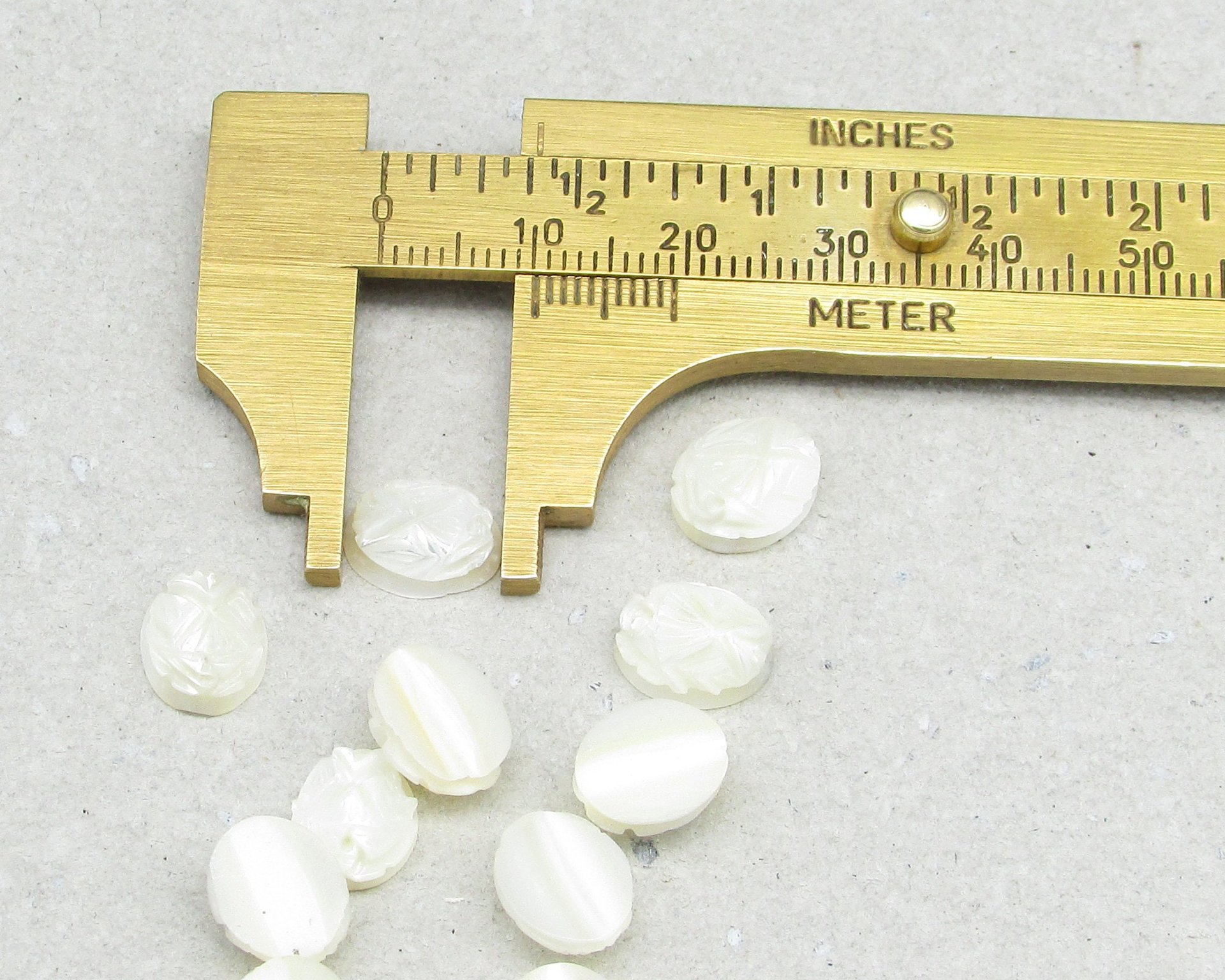 Carved Mother of Pearl Cabochon, 10x9mm Oval (12)