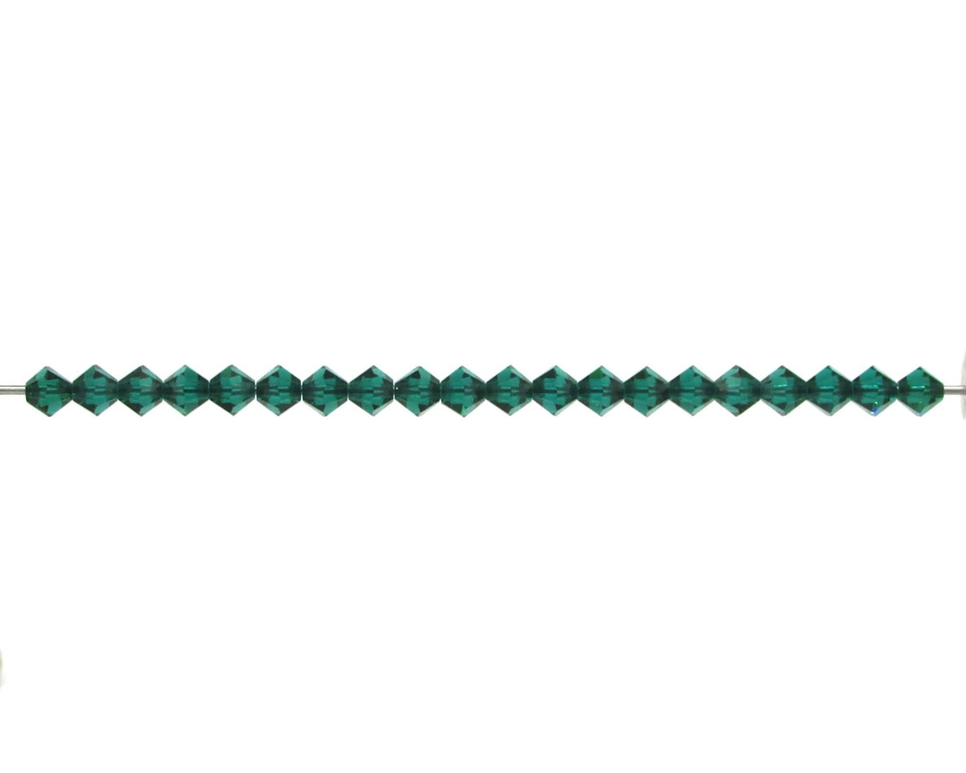 Small 4mm emerald green faceted crystal bicone beads are pointed at each end and have a hole size of approximately 0.6mm. 