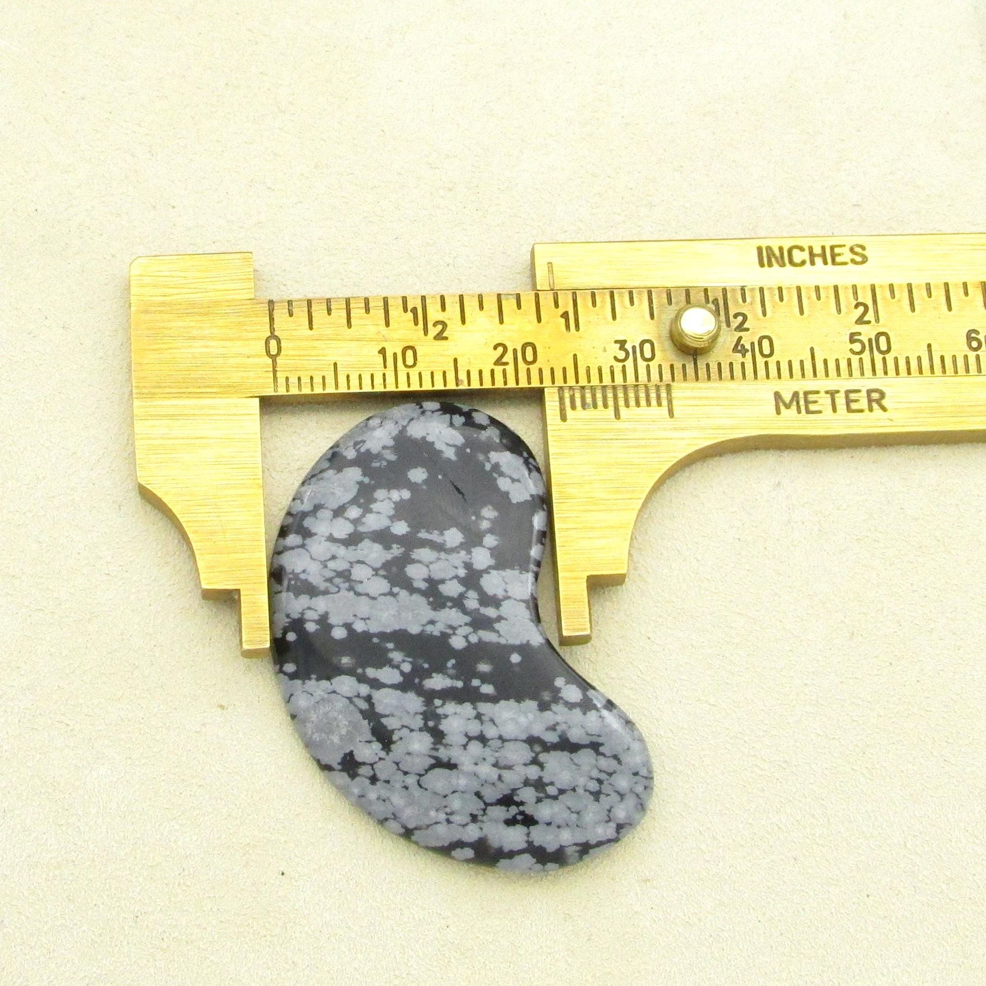 Width of the snowflake obsidian cabochon, as measured with a caliper.