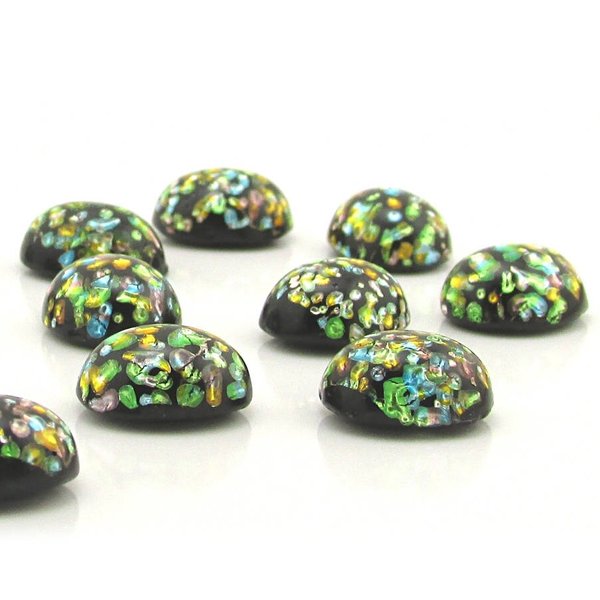 Oval glass cabochons measure 12mm long by 10mm wide, with flat backs and 6mm domes. Made by Cherry Brand artisans, these vintage foiled lampwork stones have an opaque black base with flecks of green, blue, gold and pink.