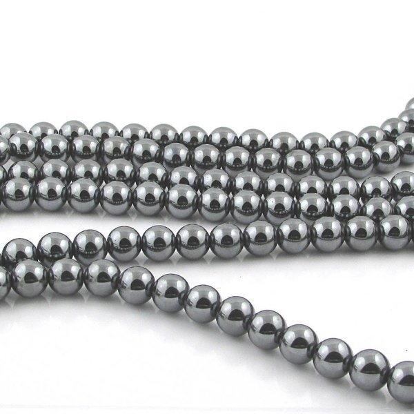 8mm round black beads are natural, non-magnetic hematite, polished to a mirror-like shine. Center-drilled holes measure 0.8mm holes. Each 16 inch strand has about 50 heavy gemstone beads and weighs approximately 2 ounces.