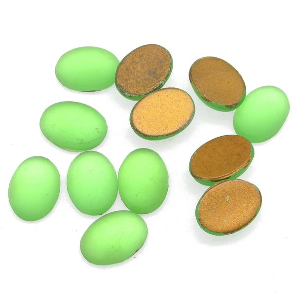 14x10mm vintage glass cabochons are matte peridot green. Smooth flat back gems have a 5mm dome and gold foiled backs.