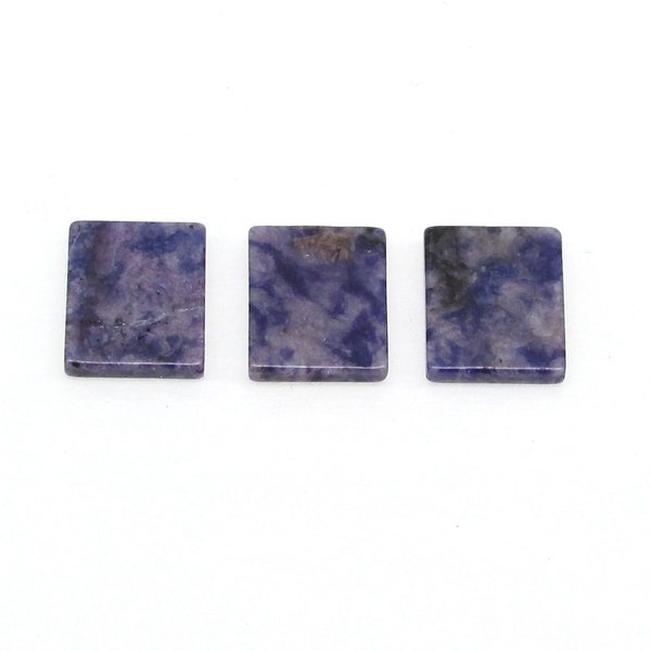 Dark blue and gray sodalite flat rectangular cabochons measure approximately 12.25x10.25mm and are 2.25mm thick, with a single bevel along the girdle. 