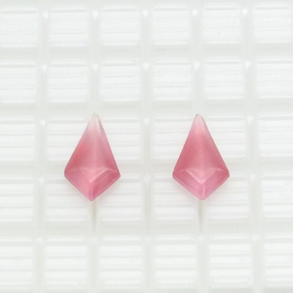 Opaque glass rhinestones are kite shaped with a smooth, rounded tops and faceted backs. Stones measure 19mm long, 11mm wide, and 5.5mm thick at the center. Pointed backs are unfoiled. Choose from either rose pink or light blue. 