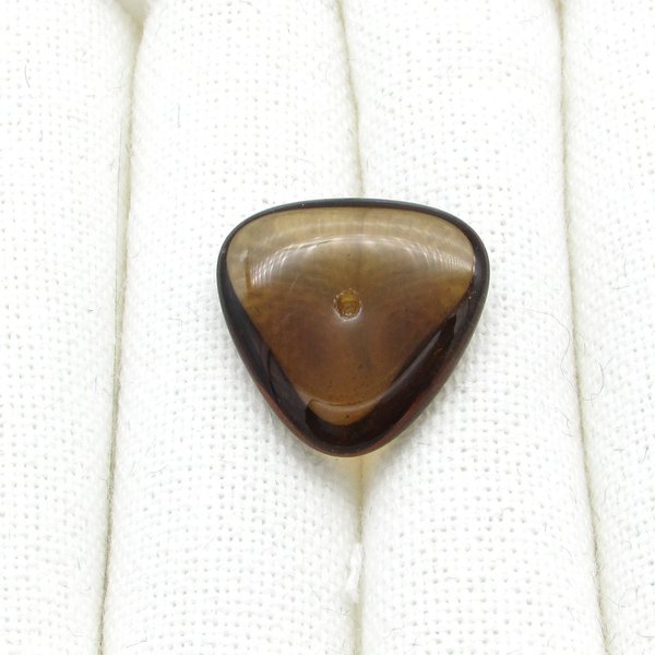 Translucent dark brown glass gem is a triangular point-back cabochon measuring 22.5mm on each side and approximately 7mm thick at the center. There is an empty round setting hole for a PP24 rhinestone is positioned in the center of the top table. 