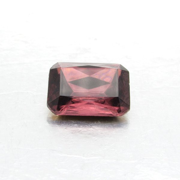 Vintage baguette rhinestone is a faceted octagon measuring 20mm long, 15.5mm wide, and 7.5mm thick at the center. Amethyst purple table cut glass has a pointed back and gold foiling.