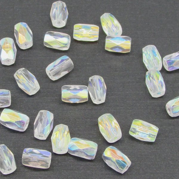 Small faceted barrel beads measure 7mm long by 5mm diameter, with a lengthwise 1mm hole. Clear fire polished glass beads have an iridescent coating.