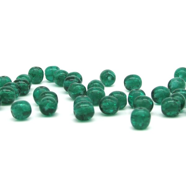 Round crackled glass beads measure 6mm in diameter with center-drilled 1mm holes. Available in several translucent colors.