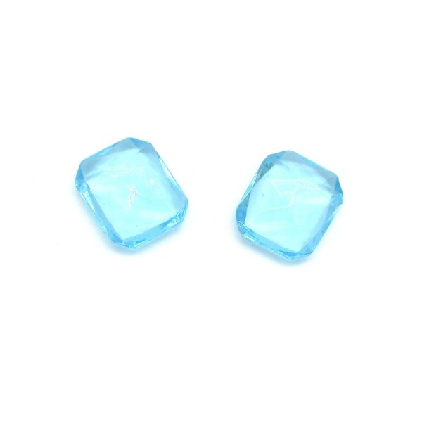 Vintage octagon rhinestones are translucent aqua with pointed, unfoiled backs. Stones measure 12mm long, 11mm wide, and 5mm thick at the center. 