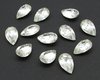 Vintage tin table cut pear shape rhinestones are clear crystal backed with gold foil. Point back stones measure 13mm long and 7.8mm wide.