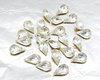 Vintage tin table cut pear shape rhinestones are clear crystal backed with gold foil. Point back stones measure 10mm long and 6mm wide.