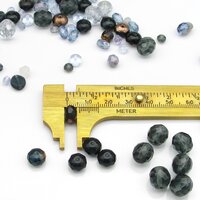 One of the small beads from the mix measured with a brass caliper.
